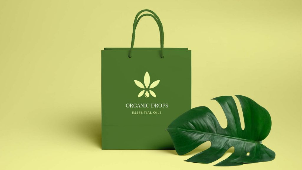 Eco-friendly shopping bag with a leaf design, symbolizing a brand committed to organic oils and sustainability.