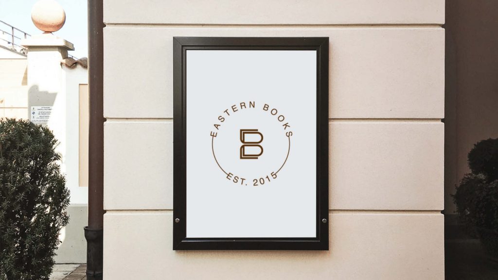 Logo design for a book company displayed on a building sign, emphasizing professional and creative branding.