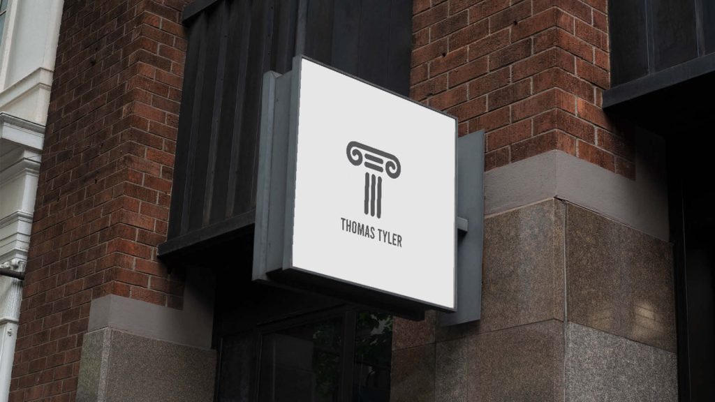 Law firm logo on a building sign, projecting authority and professionalism for the legal industry.