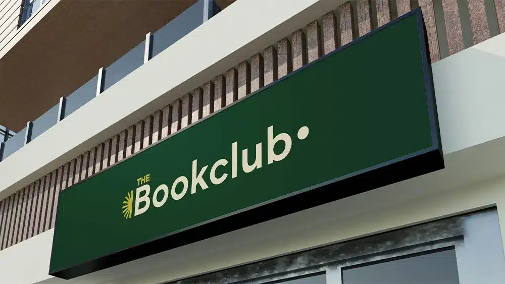 Book club logo design displayed on signage, created as part of a custom branding project for a UK-based community group