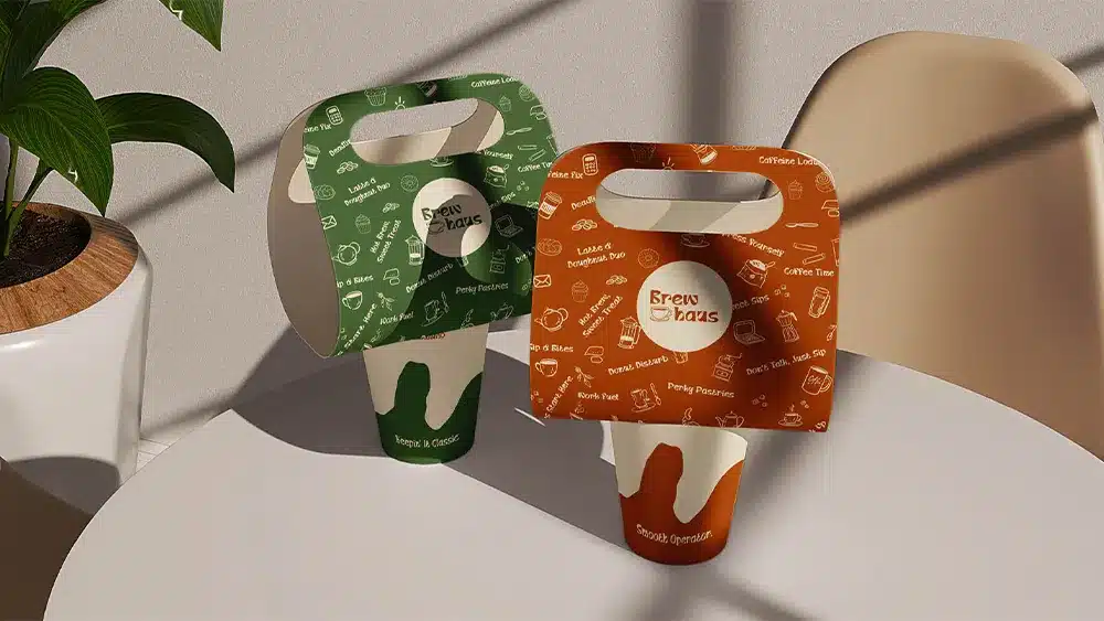 Brew Haus coffee logo and packaging design displayed on takeaway cups as part of a custom branding project